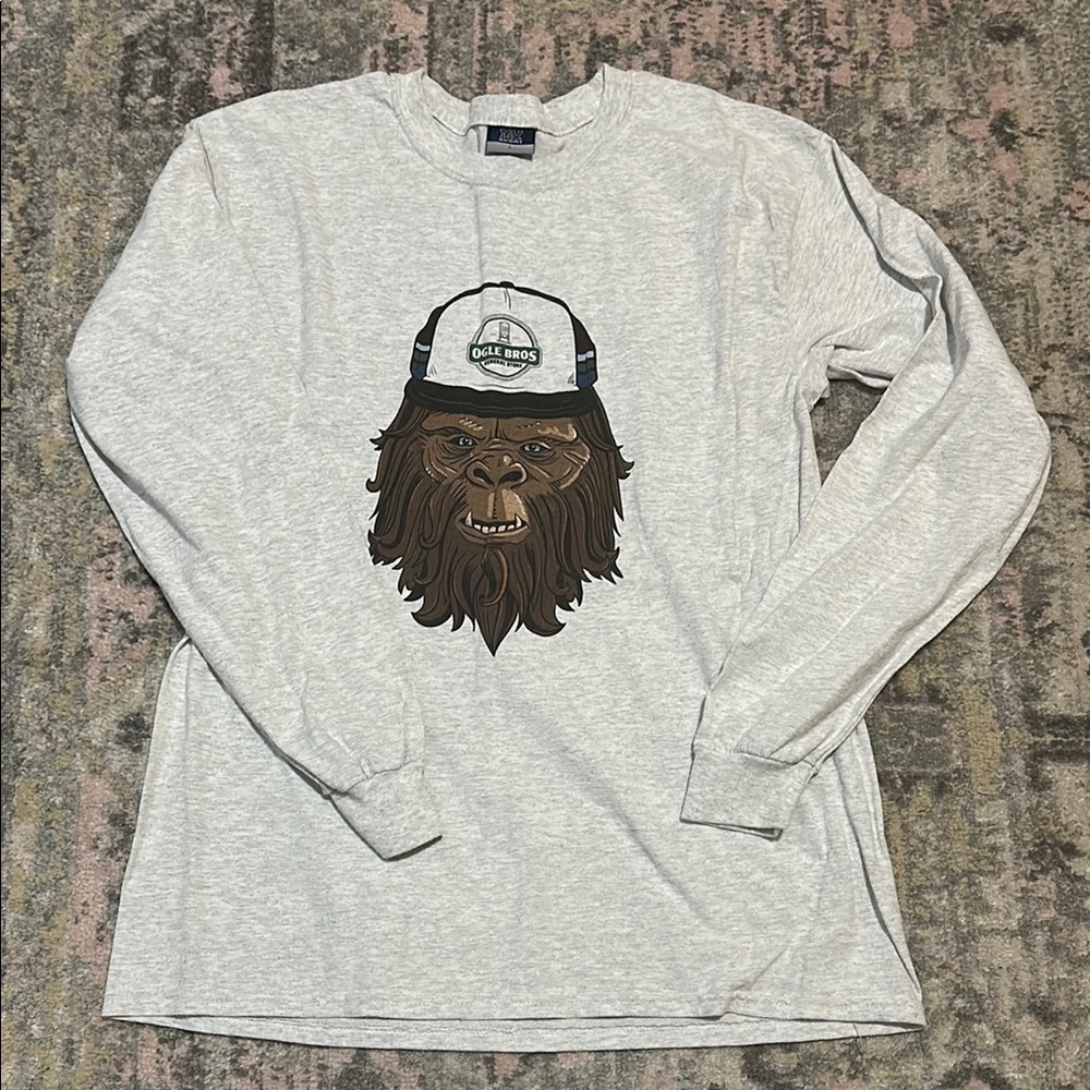 MV Sport Gray Long Sleeve Tee with Bigfoot Graphic Ogle Bros